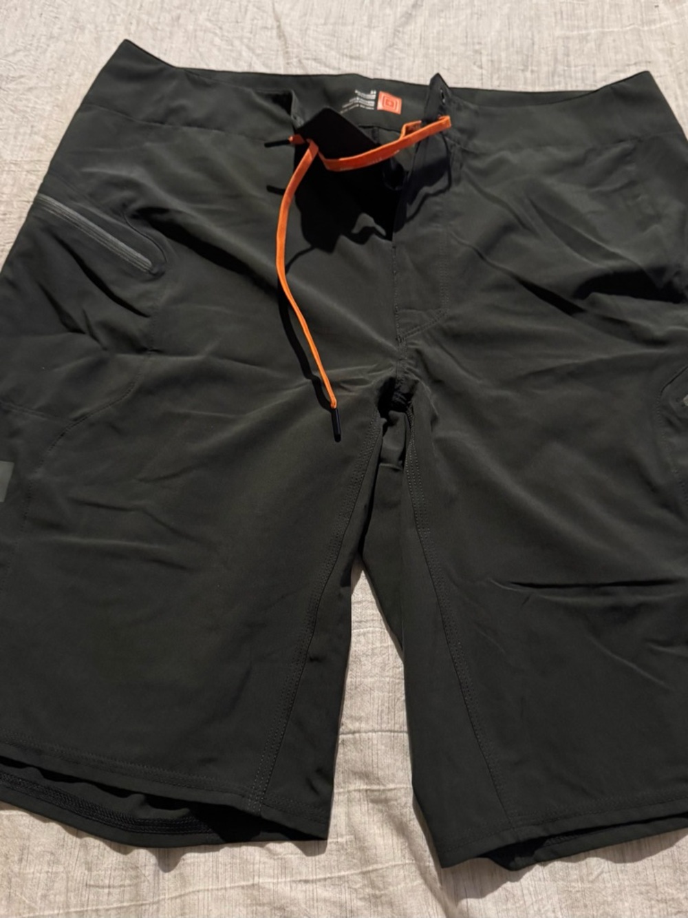 511 Black Performance Shorts with Orange Logo Detail